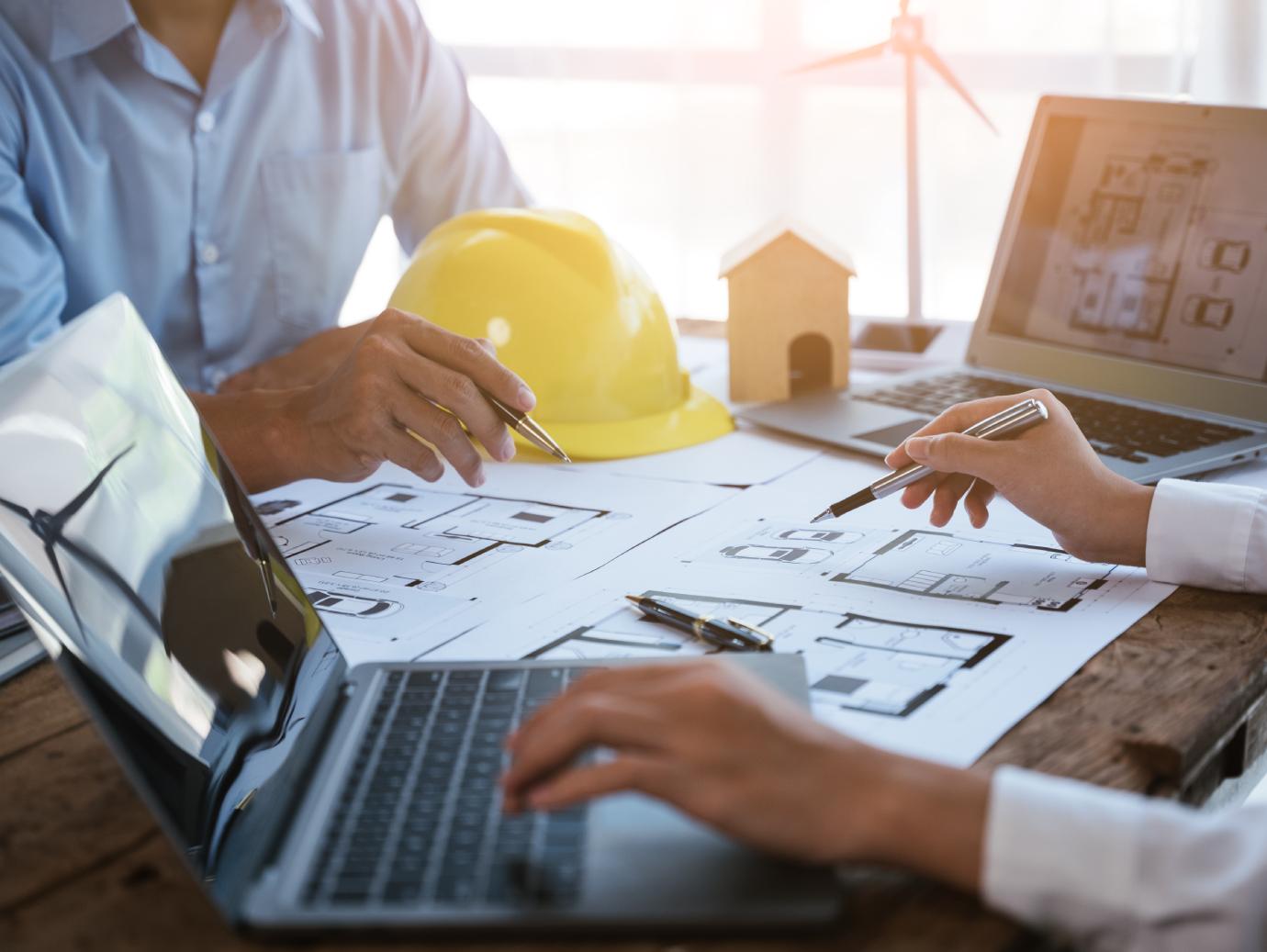 Two architects in discussion over a design project