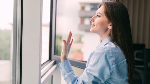 Woman breathing in enhanced indoor air through heat recovery systems